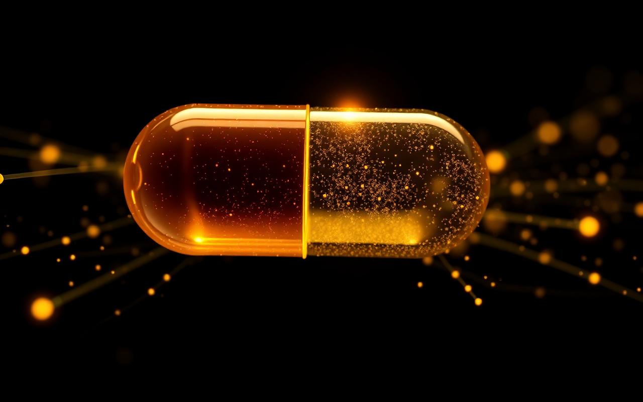 Illustration of a glowing gold capsule dispersing into energy particles